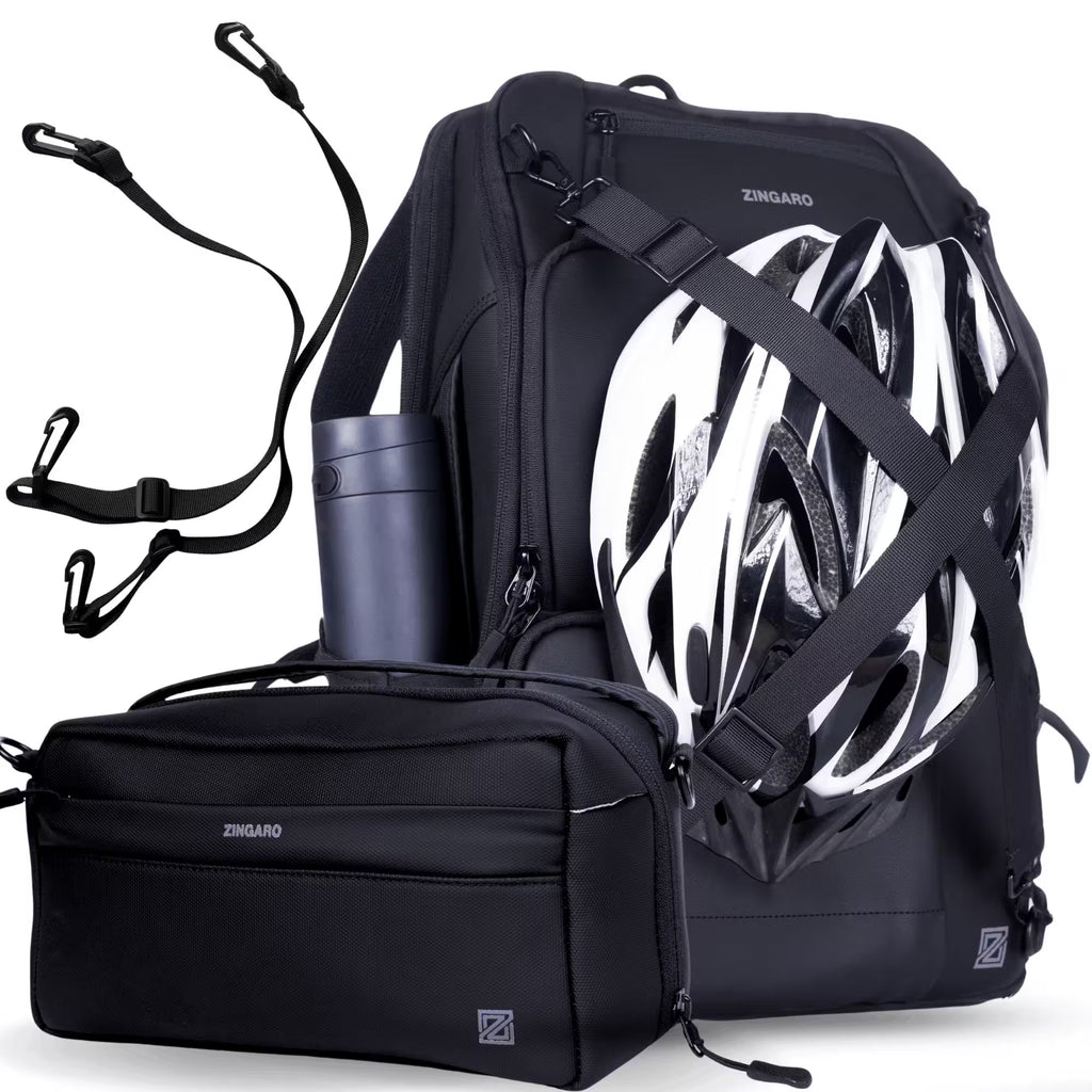 Black ZINGARO bicycle backpack set with a matching front pannier bag, shown with a white and black bicycle helmet and a dark bottle accessory on a white background.