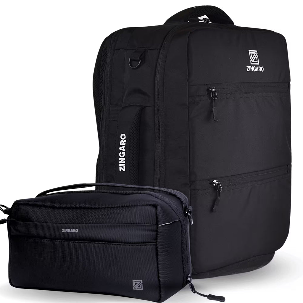 A black ZINGARO backpack shown with a matching black zippered pouch in front, photographed on a clean white studio background. The backpack has multiple zip compartments, a top handle, and a vertical ZINGARO logo on the side pocket.